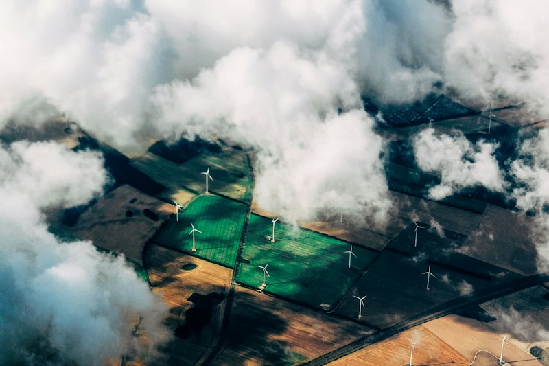 Wind farm seen from above the clouds